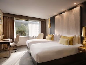 Quarto superior, 2 camas de solteiro | 1 quarto, roupas de cama premium, frigobar, cofres nos quartos