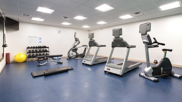 A fitness center with treadmills, elliptical machines, and free weights. - Holiday Inn Express and Suites Lincoln I - 80 by IHG (Lincoln)
