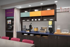 A modern cafe with a counter, seating area, and storage cabinets. - Home2 Suites by Hilton Arundel Mills/BWI Airport (Hanover)
