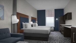 Une chambre d’hôtel moderne équipée d’un grand lit, d’un canapé, d’un bureau et d’une armoire.