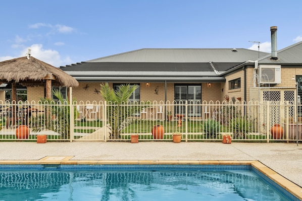 Outdoor pool, open 10:00 AM to 7:00 PM, pool loungers
