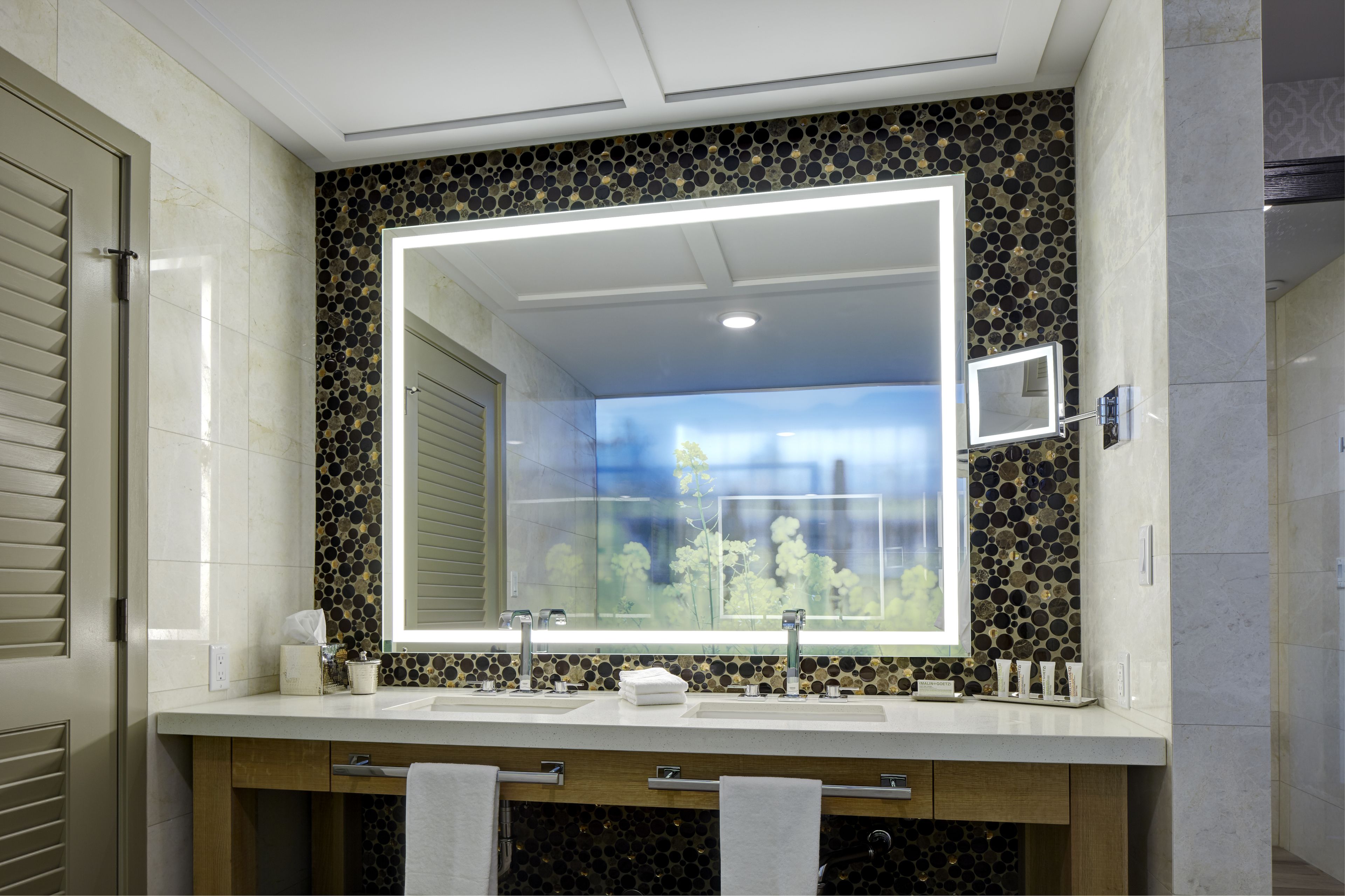 designer toiletries, hair dryer, bathrobes, slippers