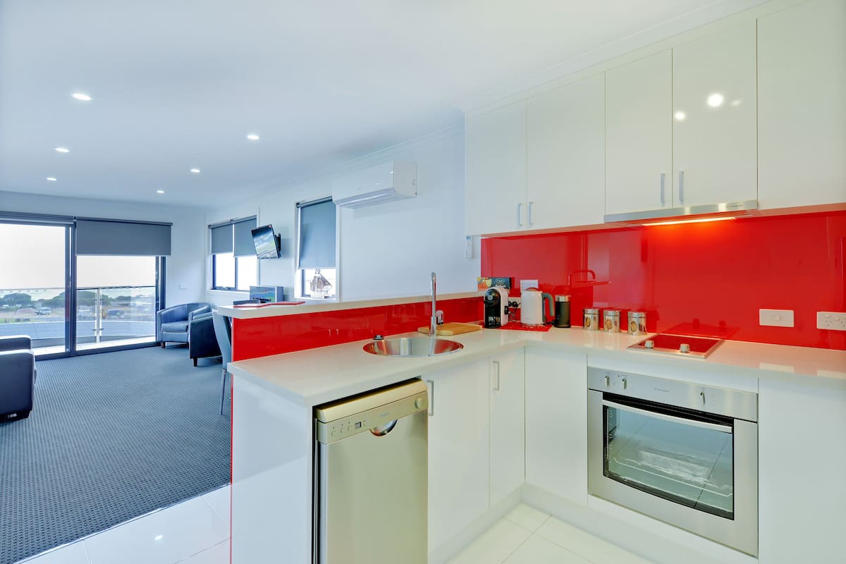 ocean deluxe apartment (upstairs with balcony) | private kitchen | full-sized fridge, microwave, oven, stovetop