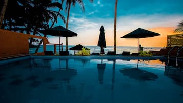 Outdoor pool, pool umbrellas, sun loungers