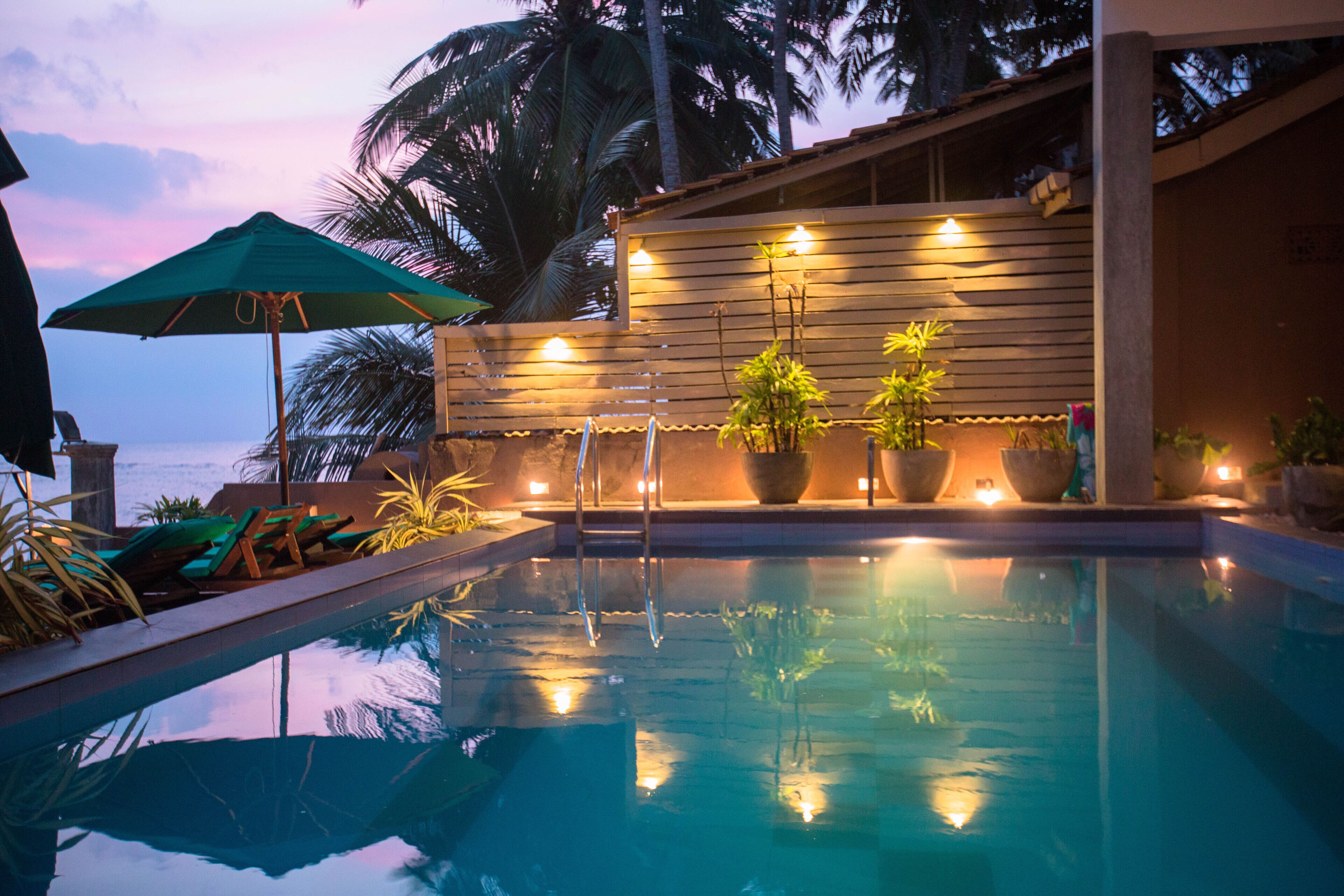 outdoor pool, pool umbrellas, pool loungers