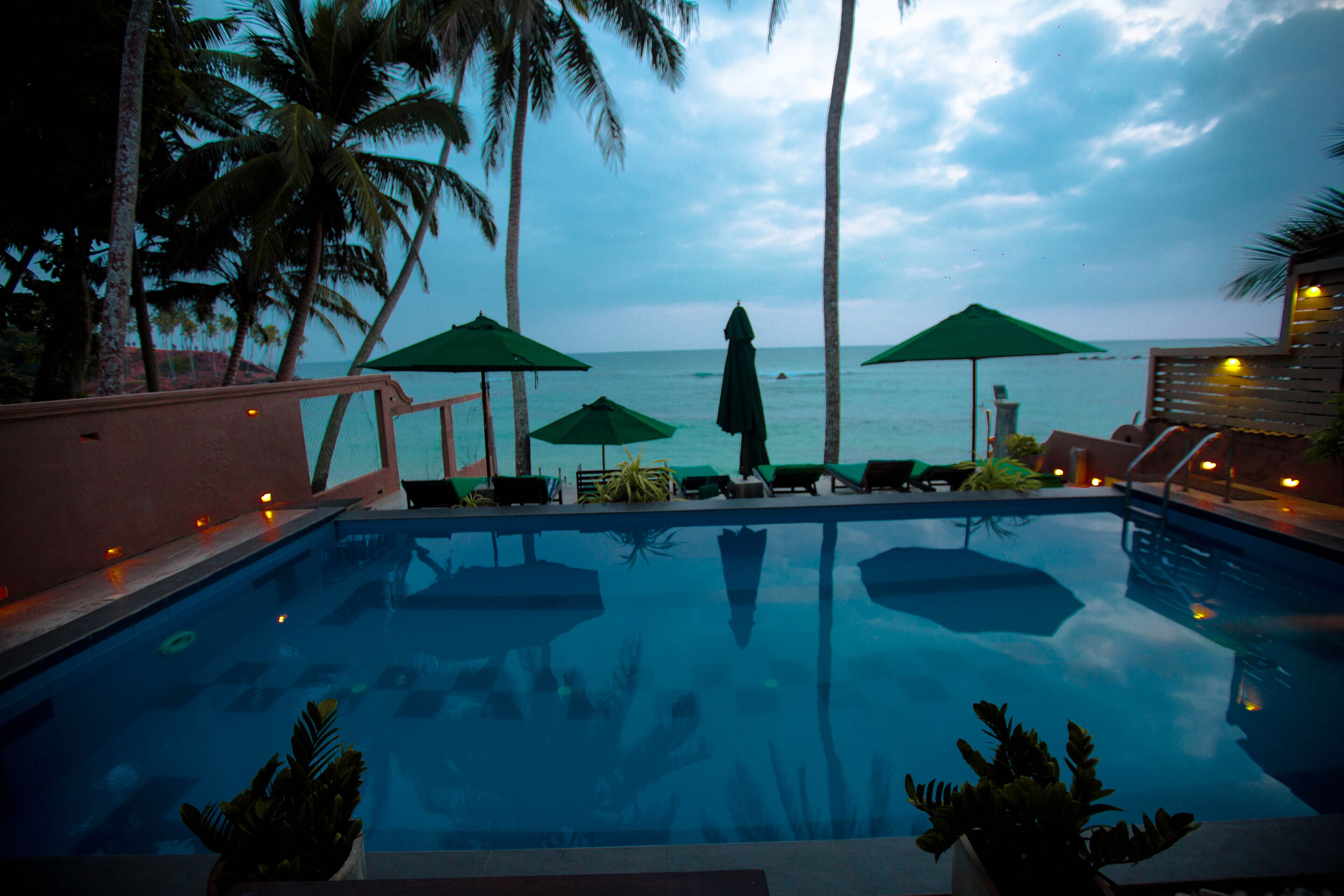 outdoor pool, pool umbrellas, pool loungers