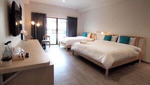 A hotel room with two beds, a desk with a mirror, and a view of the outdoors through a sliding door. - Siam Mansion Hat Yai (Hat Yai)