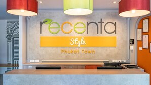 A reception desk with a sign reading "Recenta Style Phuket Town." - Recenta Style Phuket Town (Phuket)