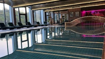 Indoor pool, open 7:00 AM to 9:00 PM, pool loungers