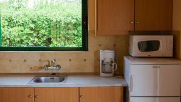 Villa, 1 Bedroom | Private kitchenette | Full-sized fridge, microwave, stovetop, coffee/tea maker