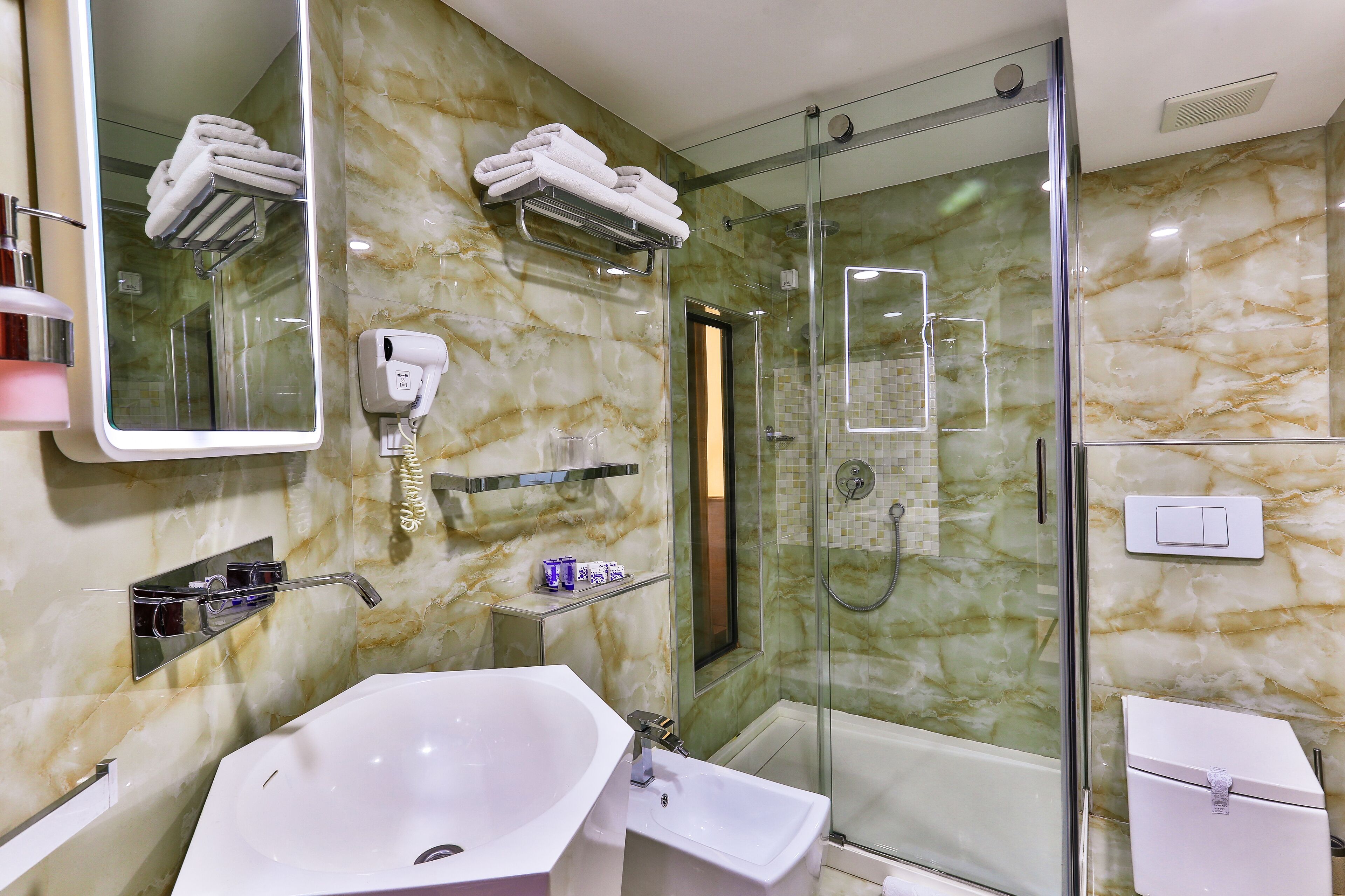 shower, free toiletries, bathrobes, slippers