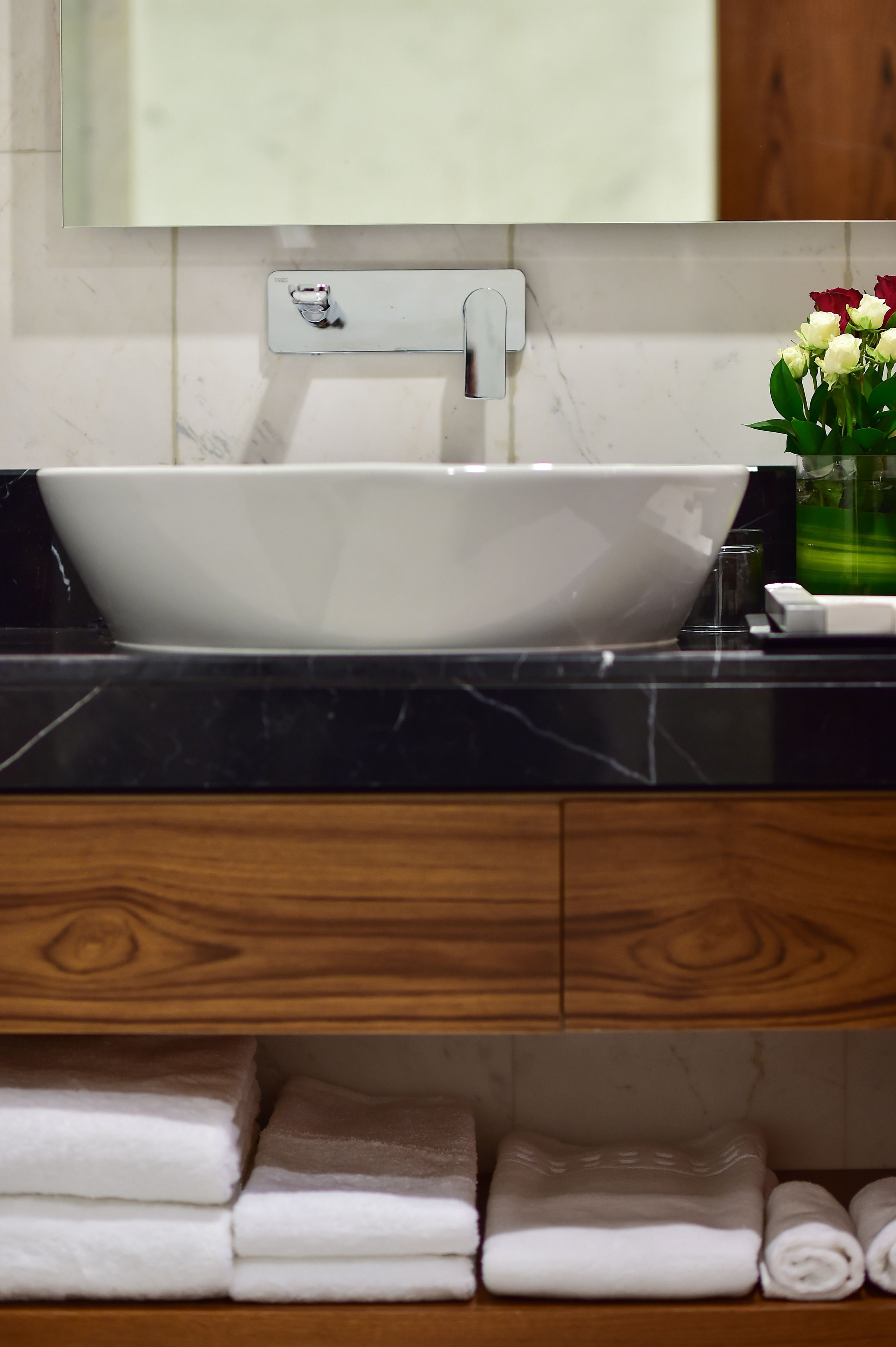 deep-soaking bathtub, rainfall showerhead, designer toiletries