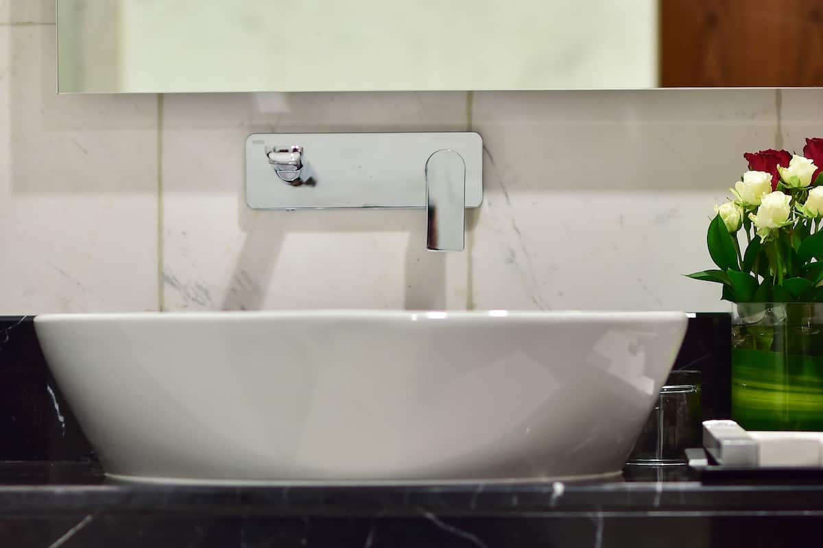 deep-soaking bathtub, rainfall showerhead, designer toiletries