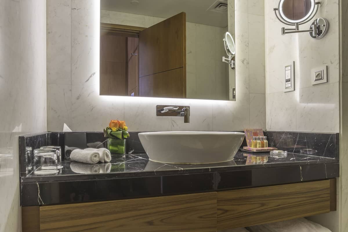 superior double room | bathroom | deep-soaking bathtub, rainfall showerhead, designer toiletries