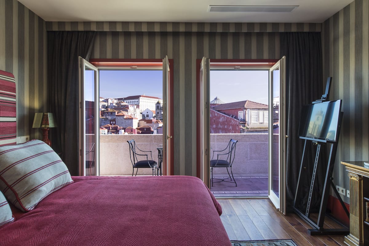 Suite Deluxe, vista a la ciudad | 1 habitación, ropa de cama de alta calidad y minibar