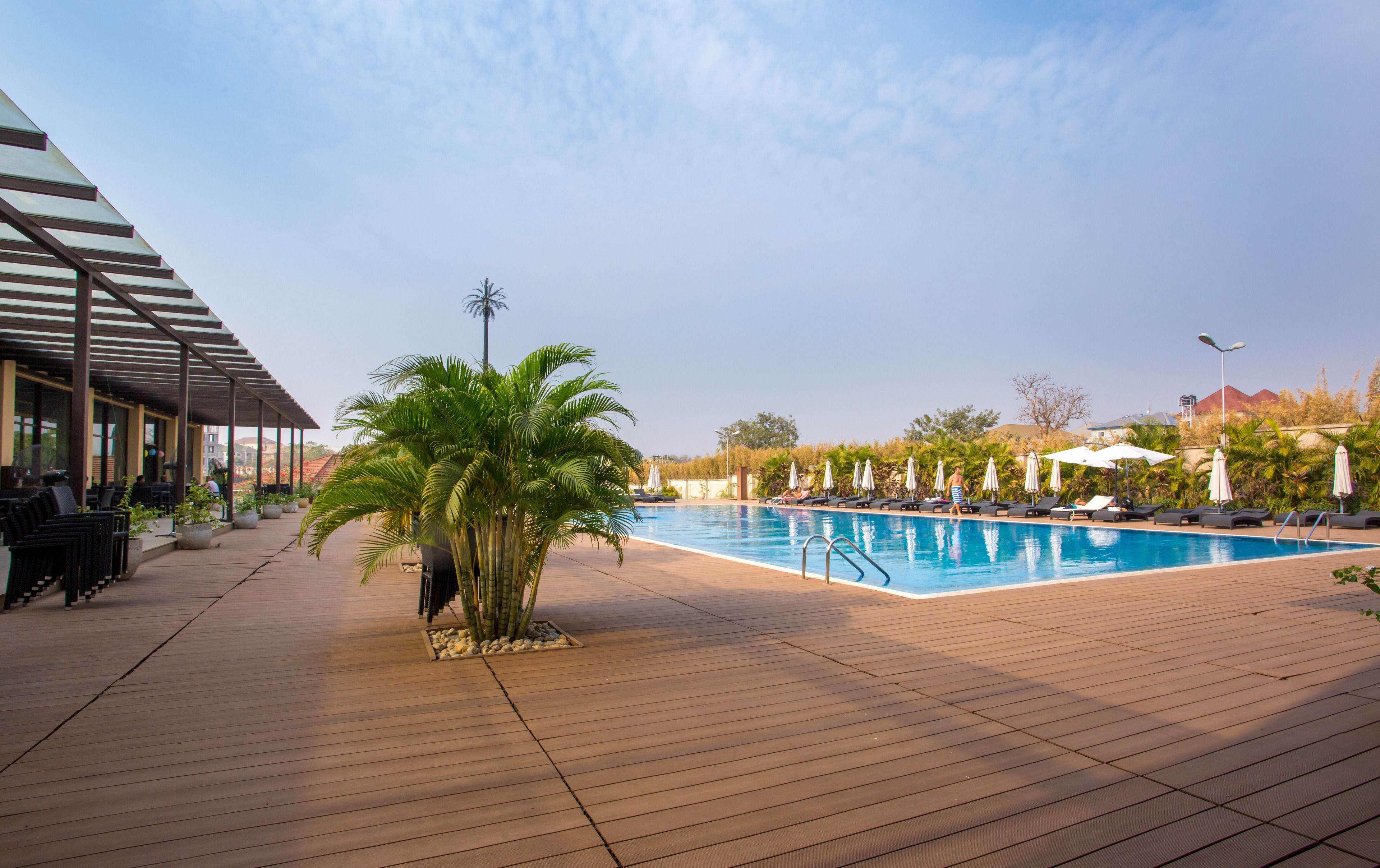 outdoor pool, pool umbrellas, pool loungers