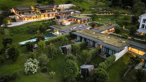A modern multi-story house with a large outdoor deck, a swimming pool, and a well-maintained garden. - Wiesergut (Saalbach-Hinterglemm)