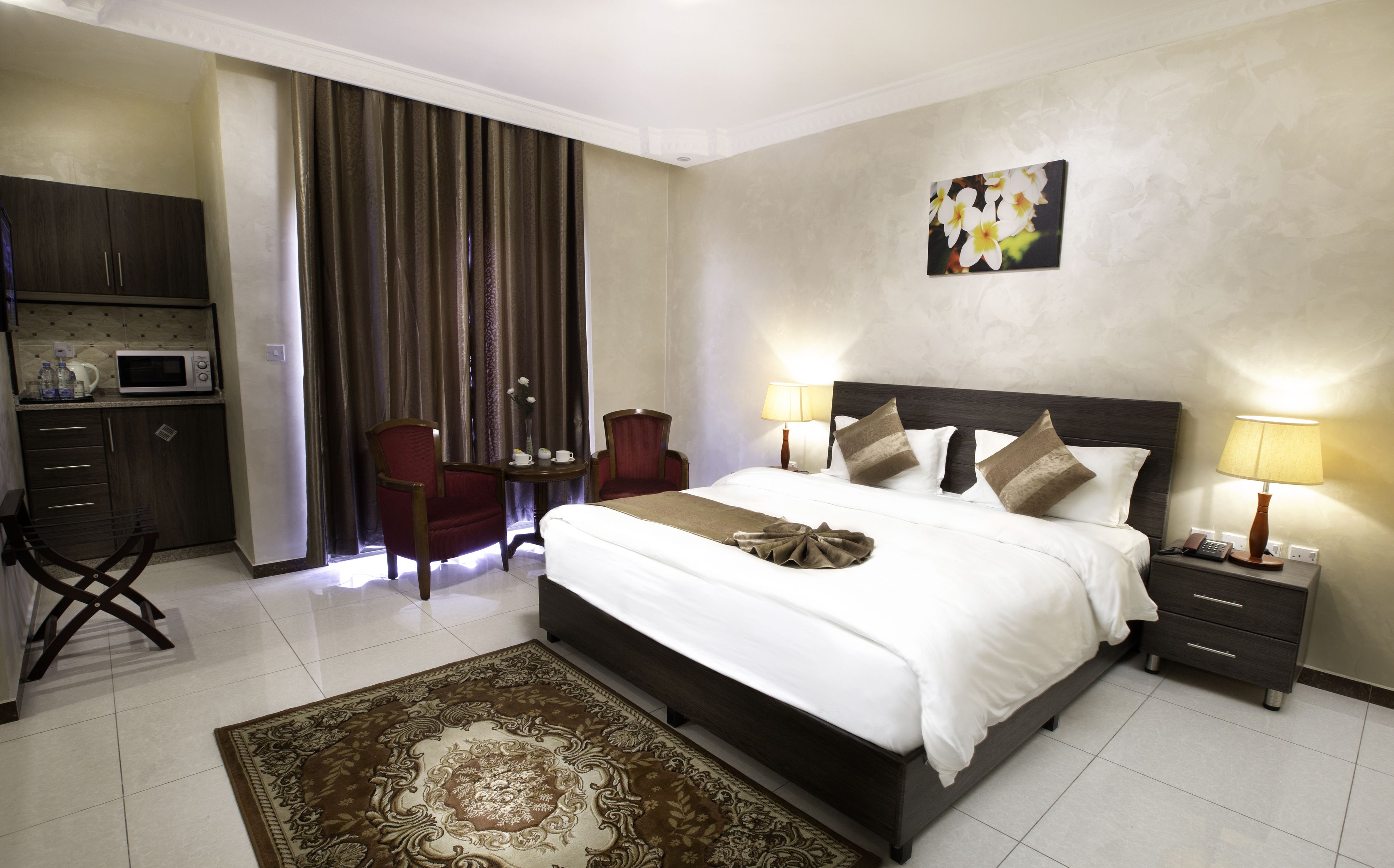 junior suite | minibar, in-room safe, desk, iron/ironing board