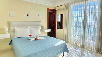 Deluxe Apartment, 2 Bedrooms, Kitchenette, Ocean View | 1 bedroom, down comforters, in-room safe, blackout drapes