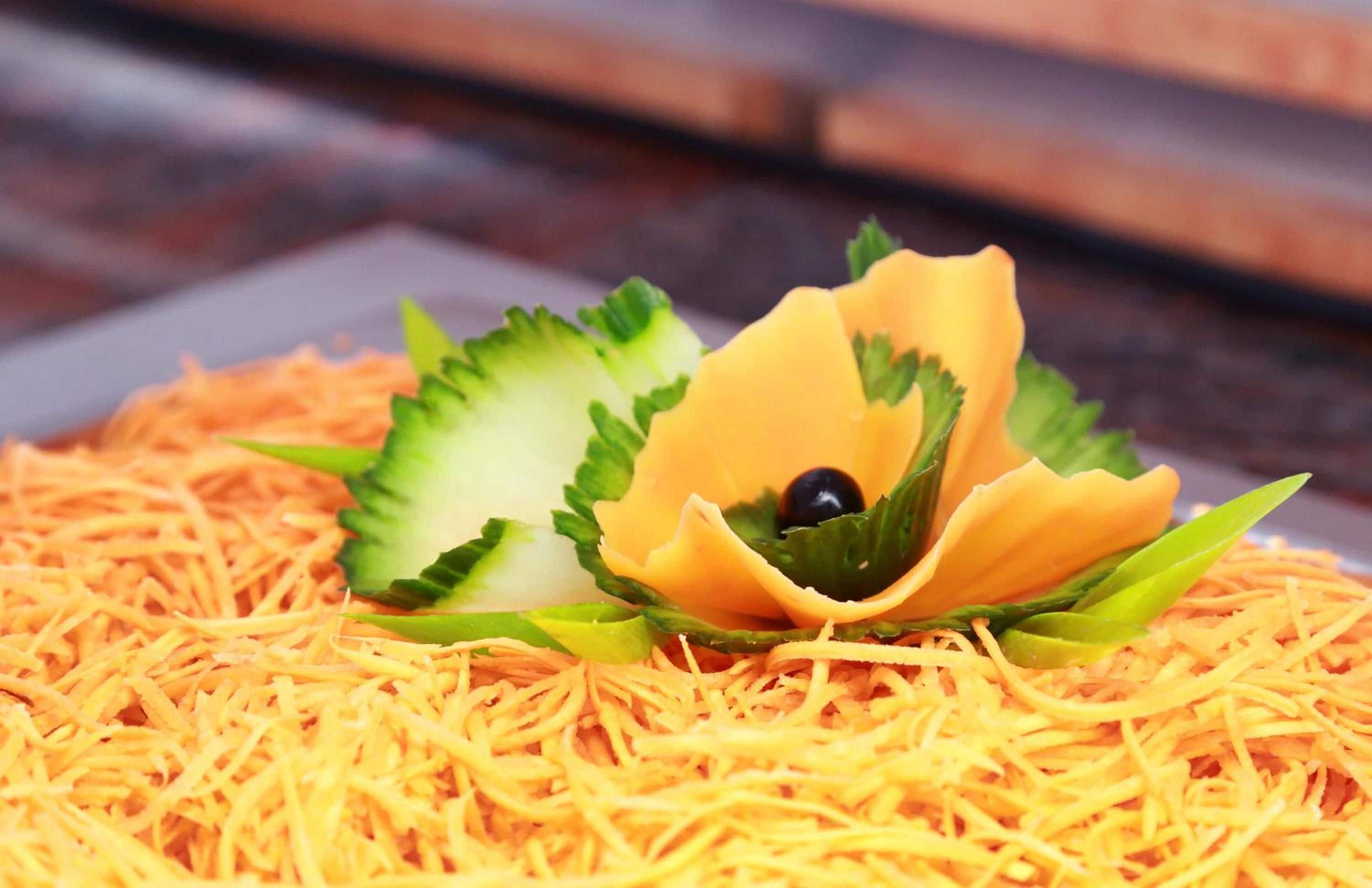 A decorative arrangement of shredded material with a flower-like structure in the center.