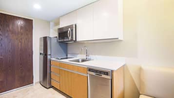 Fridge, microwave, coffee/tea maker, cookware/dishes/utensils