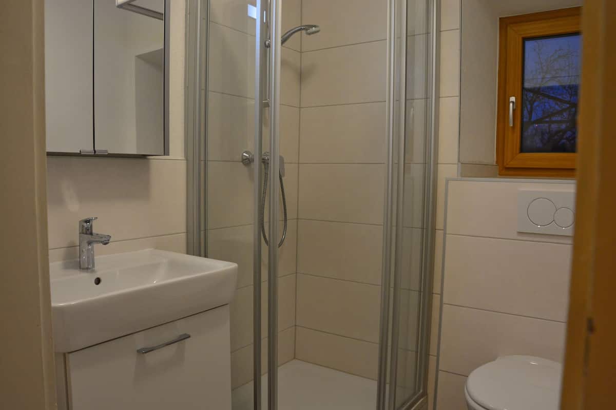 family condo, 1 bedroom, balcony, mountain view | bathroom | shower, designer toiletries, hair dryer, towels