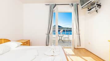 Double Room, Balcony, Sea View | Blackout drapes, bed sheets