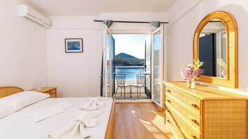 Family Room, Balcony, Sea View | Blackout drapes, bed sheets