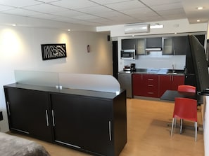 Deluxe Studio Suite, 1 King Bed with Sofa bed, Kitchenette, City View | Minibar, in-room safe, desk, soundproofing