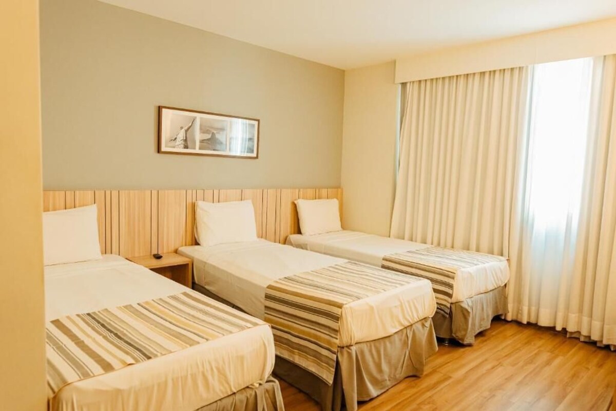 Standard Room, 3 Twin Beds | Minibar, in-room safe, desk, laptop workspace