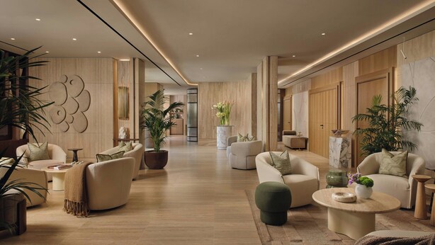 A spacious living area with sofas, a coffee table, and decorative plants. - Principessa Forte dei Marmi, Autograph Collection (Forte dei Marmi)