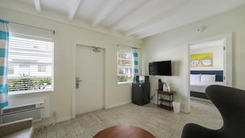 Junior Apartment, 1 King Bed with Sofa bed, Private Bathroom (Self check-in) | Living area | 42-inch Smart TV with satellite channels
