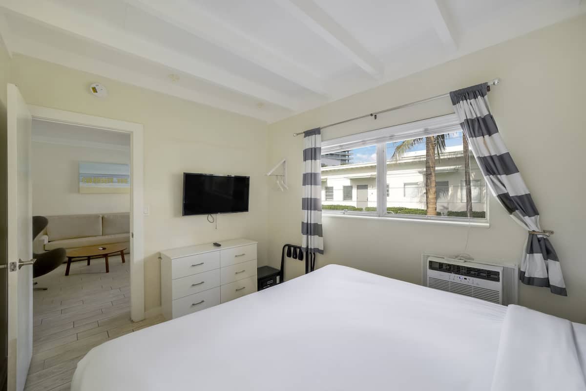 Junior Apartment, 1 King Bed with Sofa bed, Private Bathroom (Self check-in) | In-room safe, desk, laptop workspace, blackout drapes