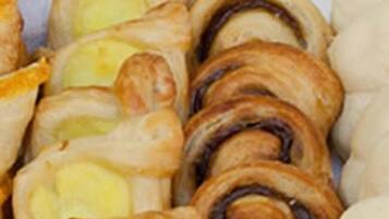 A variety of pastries in a basket.