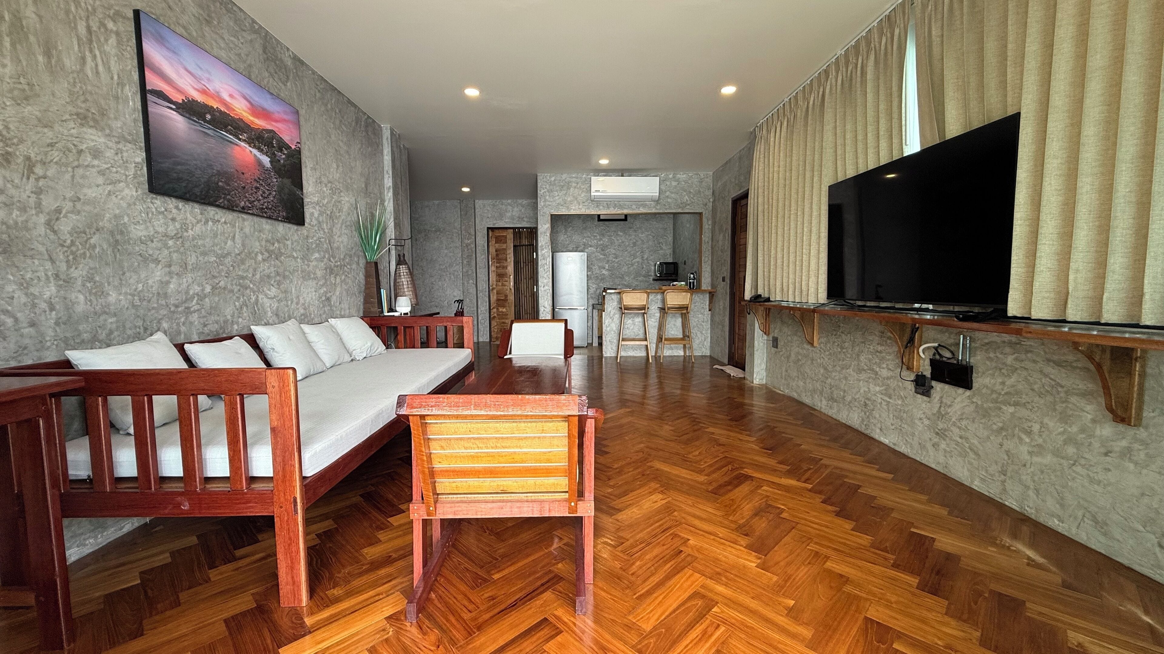 deluxe villa, 2 bedrooms | living area | flat-screen tv