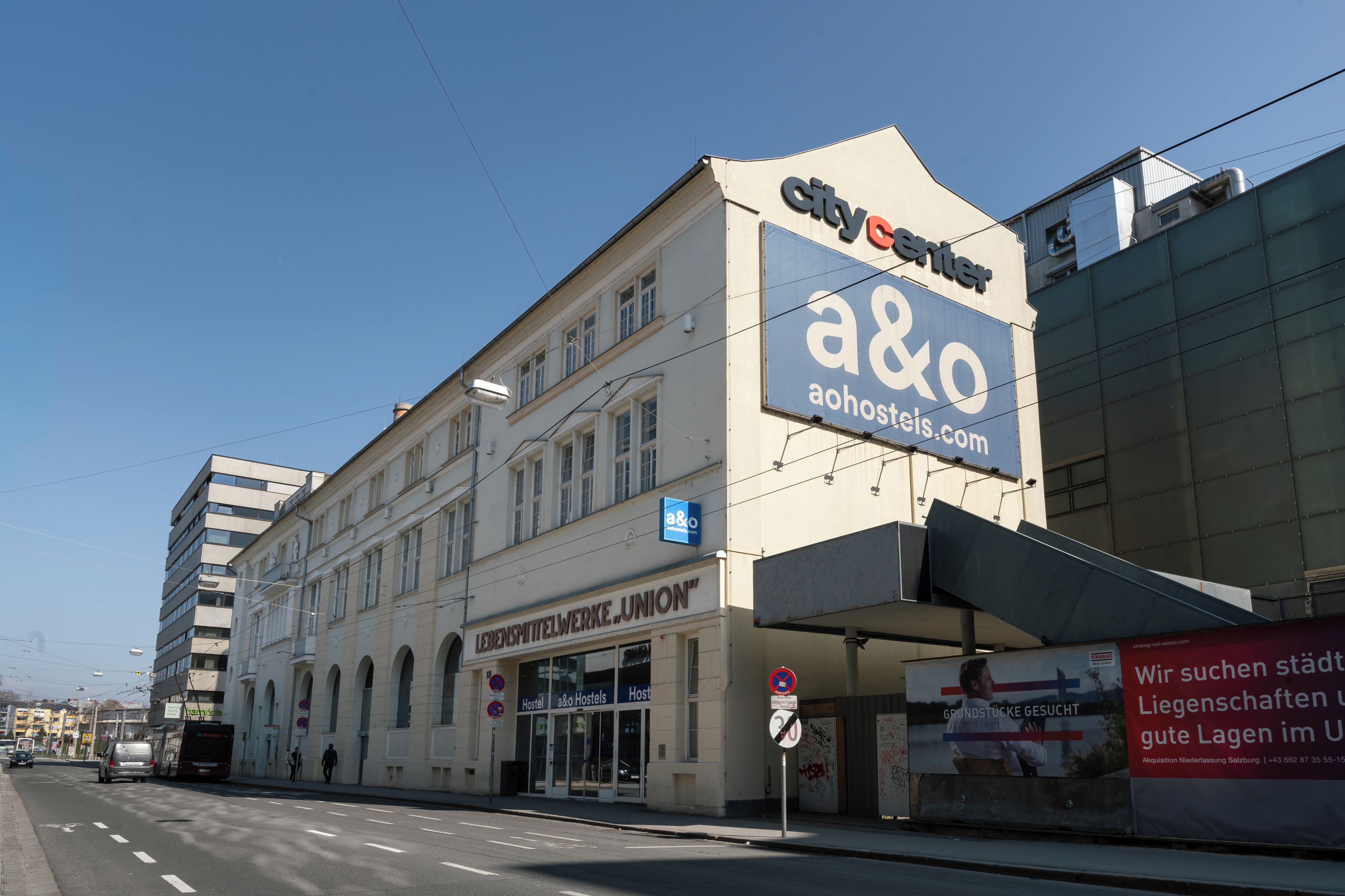 A building with a sign for 'city center' and 'a&o' indicating a hostel.