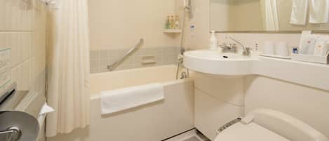 Un baño con bañera, inodoro, lavabo y ducha.