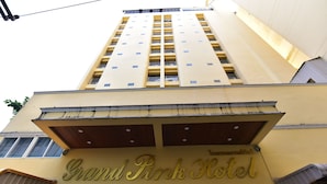 The Grand Pink Hotel with a prominent yellow facade and a sign indicating it is a hotel. - Grand Pink Hotel Hat Yai (Hat Yai)