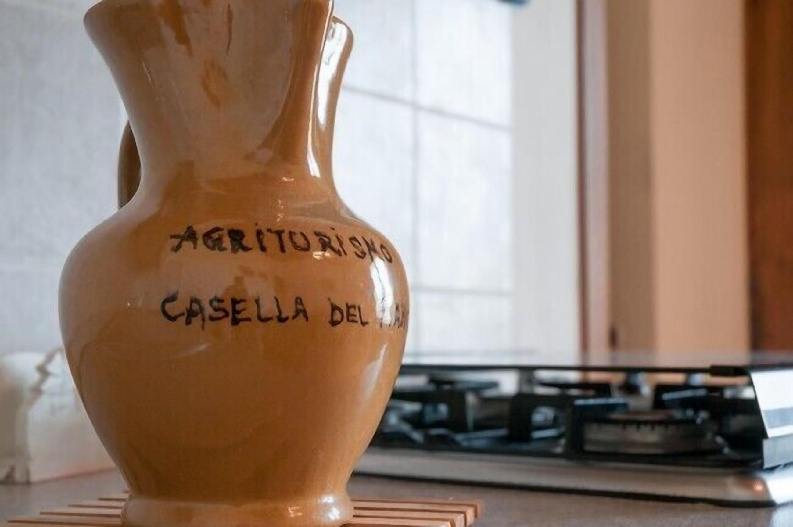 A ceramic pitcher with inscriptions.