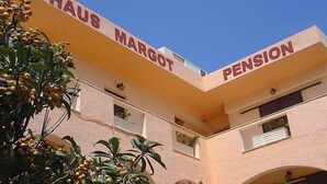 A building with the sign "HAUS MARGOT PENSION" indicating it is a pension building.