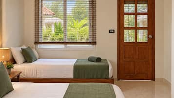 Standard Triple Room, 1 Bedroom, Balcony, Garden Area | In-room safe, bed sheets