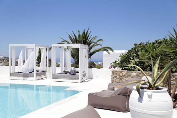 Seasonal outdoor pool, open 11:00 AM to 8:00 PM, free pool cabanas