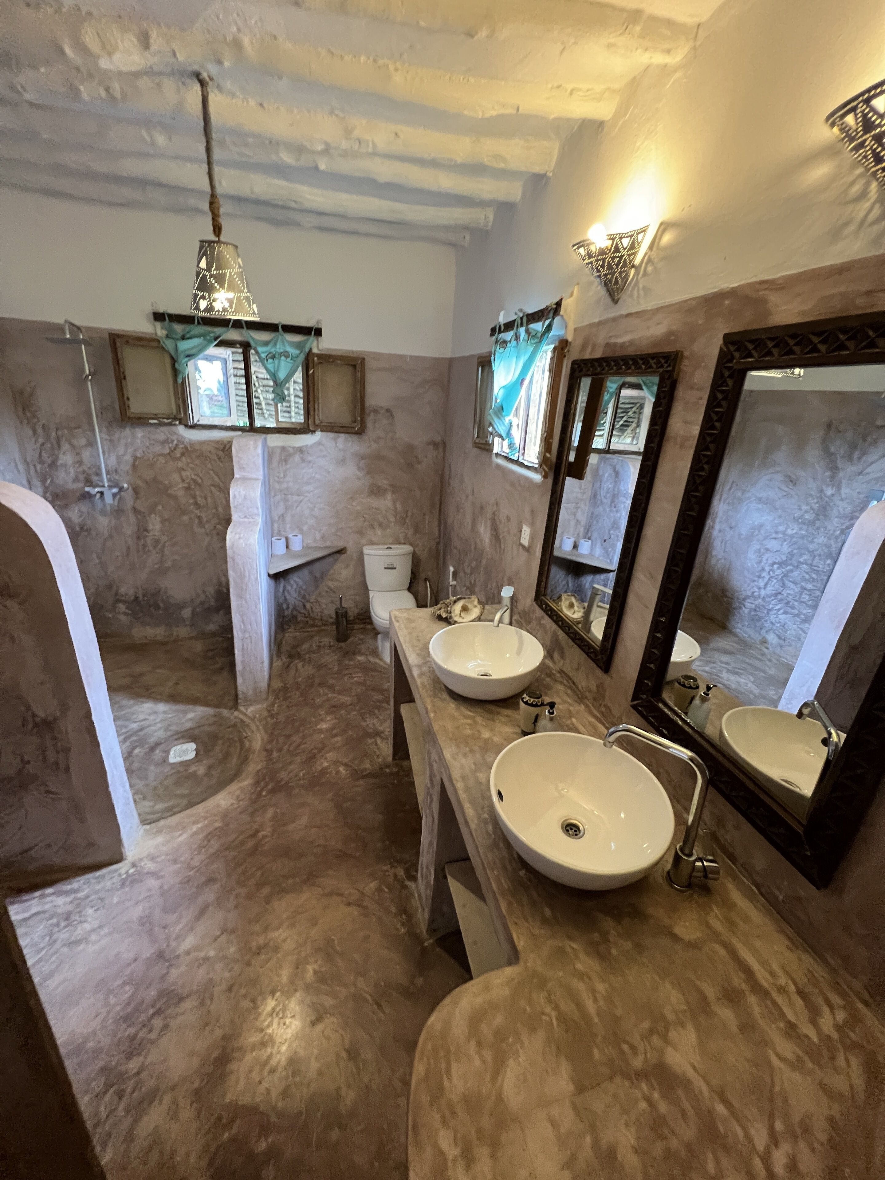 deluxe studio suite | bathroom | shower, rainfall showerhead, hair dryer, towels