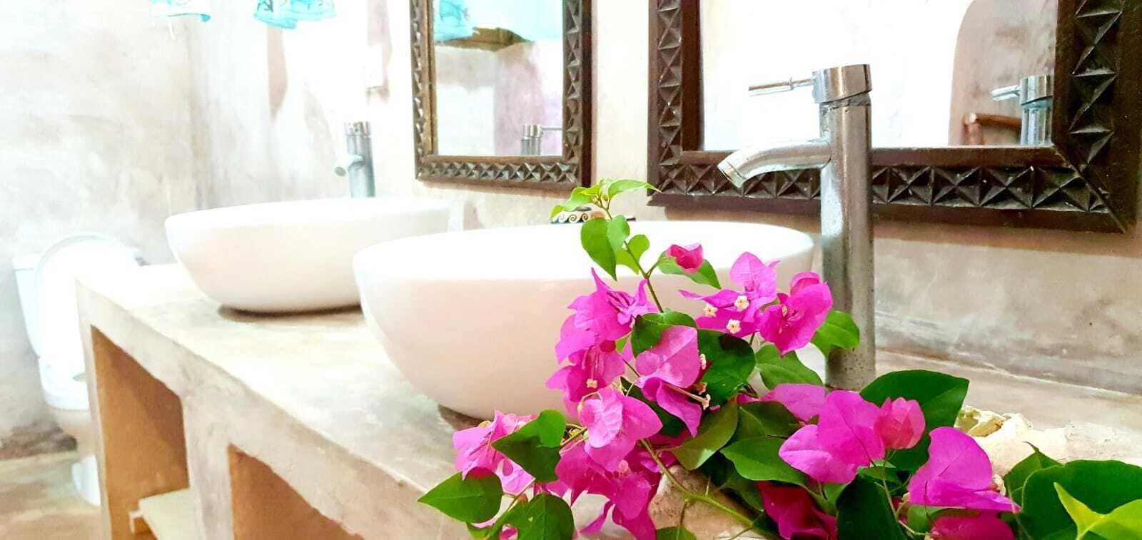 deluxe studio suite | bathroom | shower, rainfall showerhead, hair dryer, towels