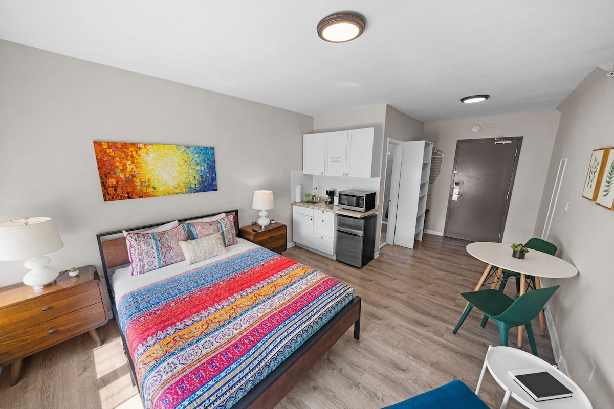 Standard Queen Studio w/ Balcony & Kitchenette | Individually decorated, individually furnished, laptop workspace