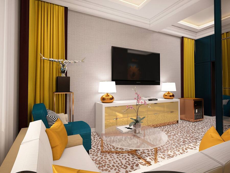A modern living room with a sofa, a coffee table, a TV, and a lamp.