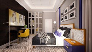 Une chambre moderne comprenant un lit, un bureau, une chaise et une armoire.