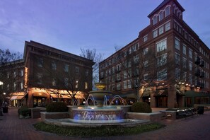 A brick building with a fountain in front, labeled "The Village of Providence."