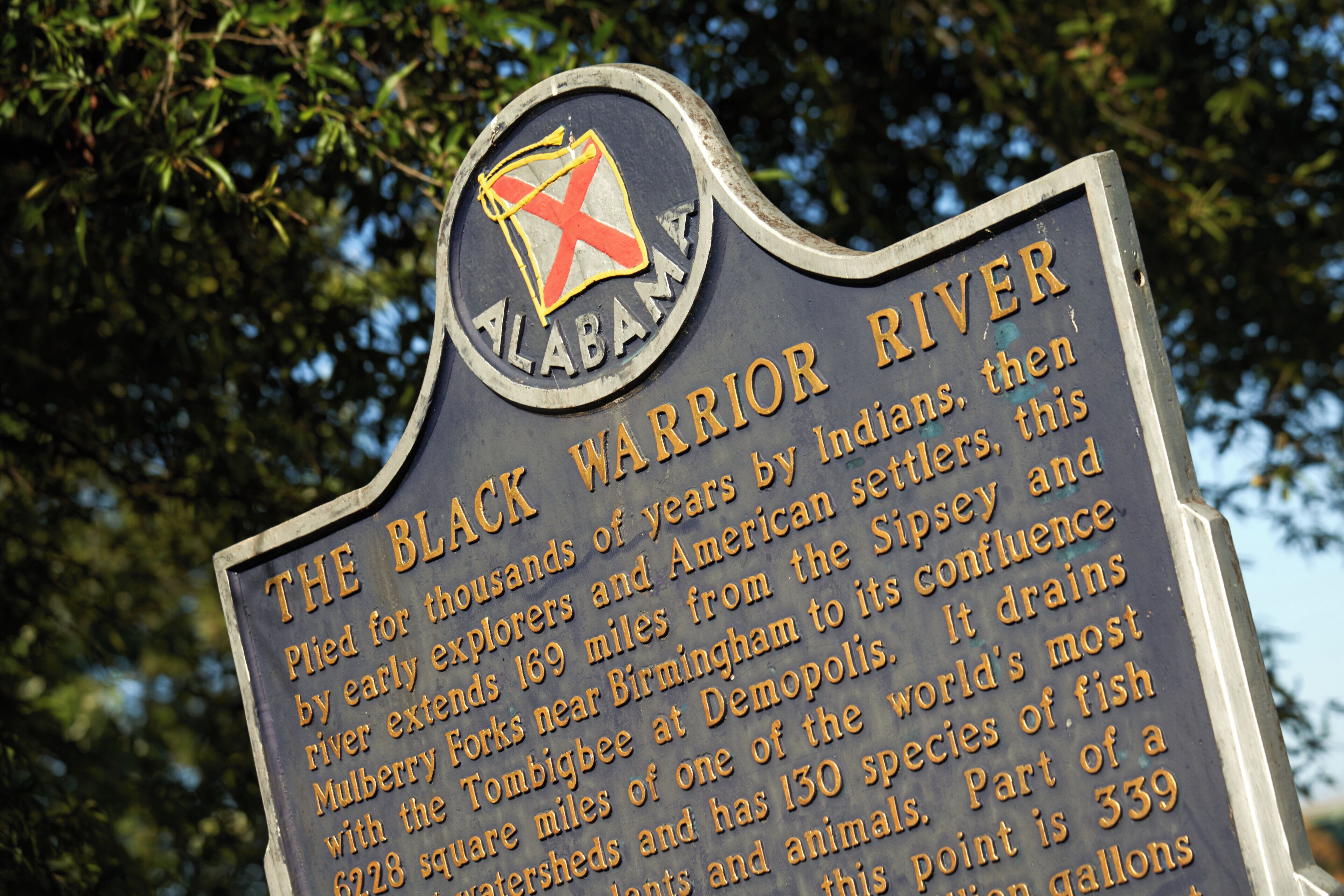 A historical marker sign with text detailing the Black Warrior River's history.