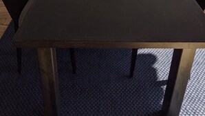A conference room with a long table, chairs, and potted plants. - Auberge de Nos Aïeux (Les Eboulements)